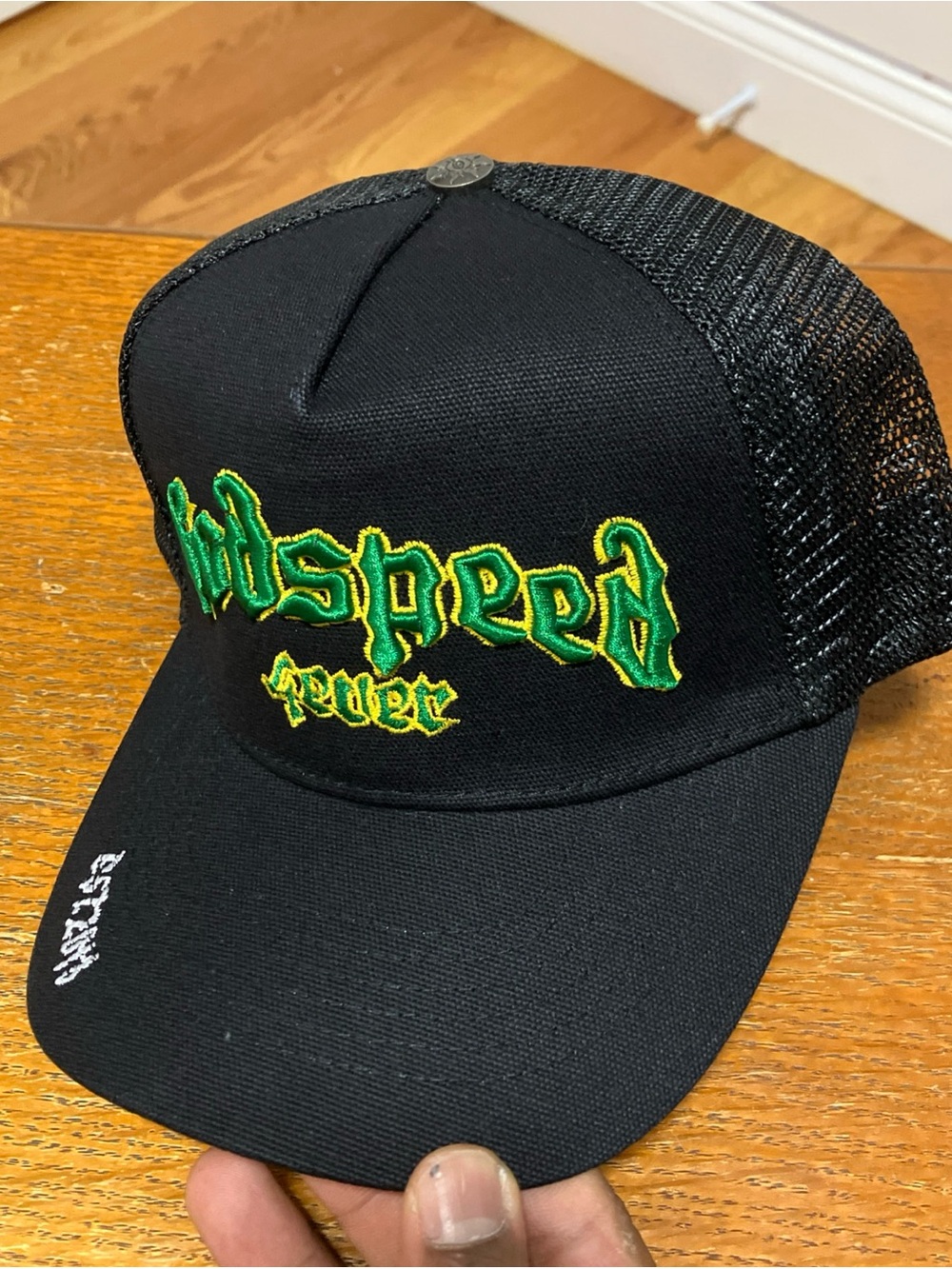 Black Trucker Hat with Green & Yellow Embroidery